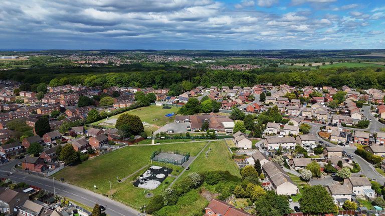 A view over the parish from a drone showing the primary school and the landscape into the distance